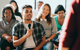 Person speaking at a community event